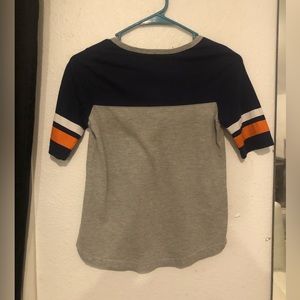 It’s a half sleeve t shirt that is broncos.